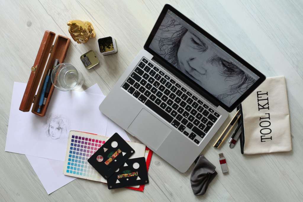 graphic design as a hobby. pic of laptop and design tools