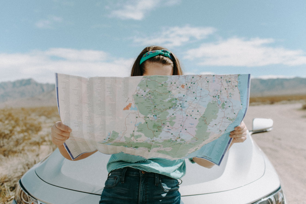 travel as a profitable hobby. pic of a person holding a map.