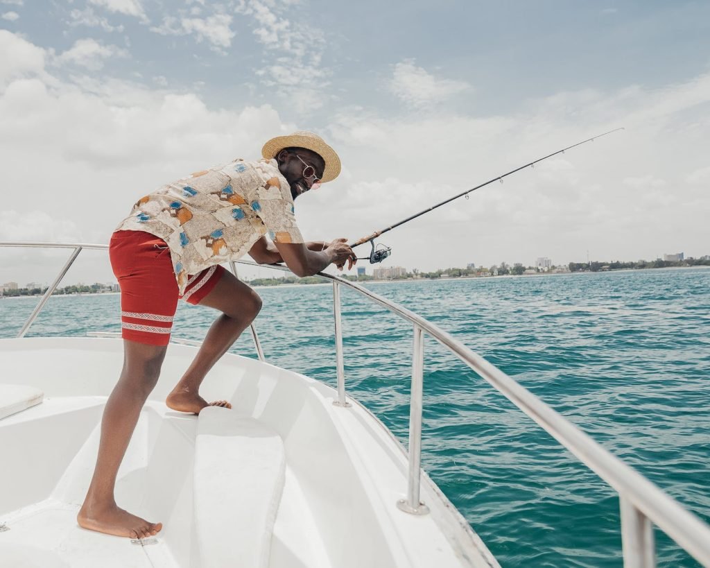 Best Cheap Hobbies To Make Money (List & Guide): man fishing on a yacht