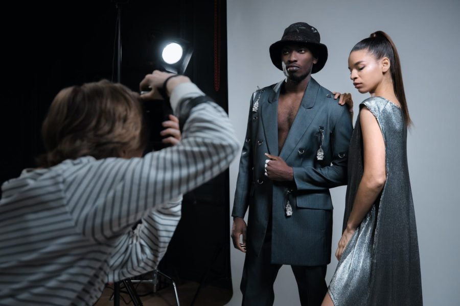 photographer taking pictures of models: How to Make Money with Photography in South Africa 