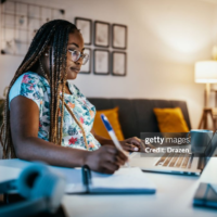 person on a desk learn online with her pc